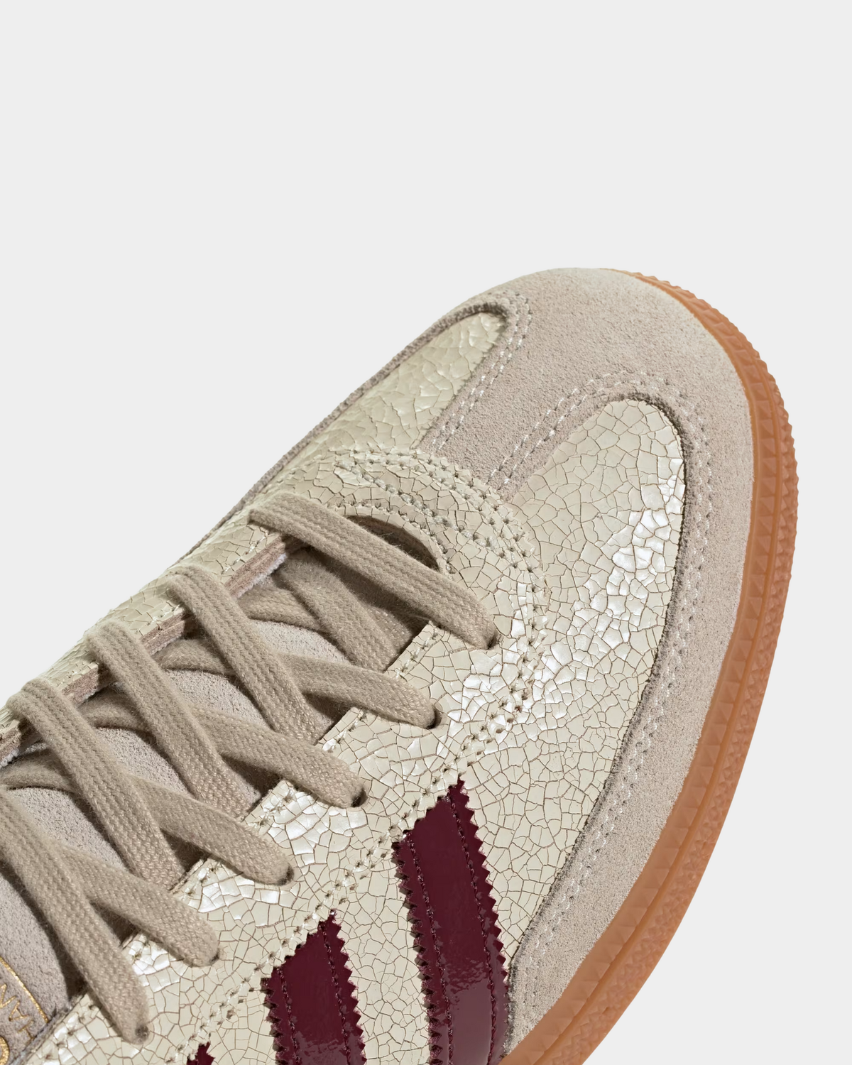 adidas Handball Spezial in off white with shadow red, low-top leather and suede sneakers on a gum sole