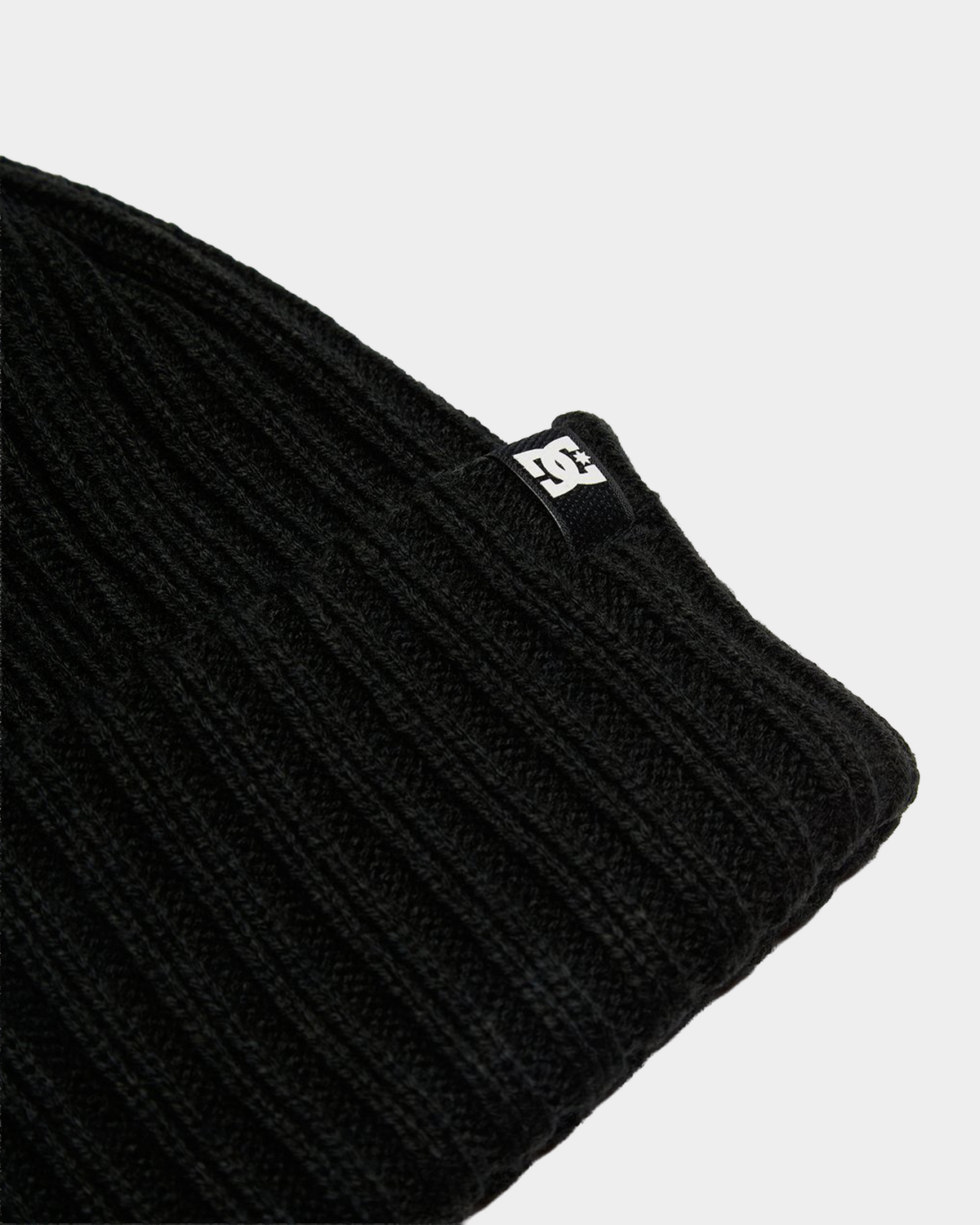 DC Fish N Destroy kids beanie in black, a cuffed 2x1 rib-knit beanie with a woven DC label on the turn-up