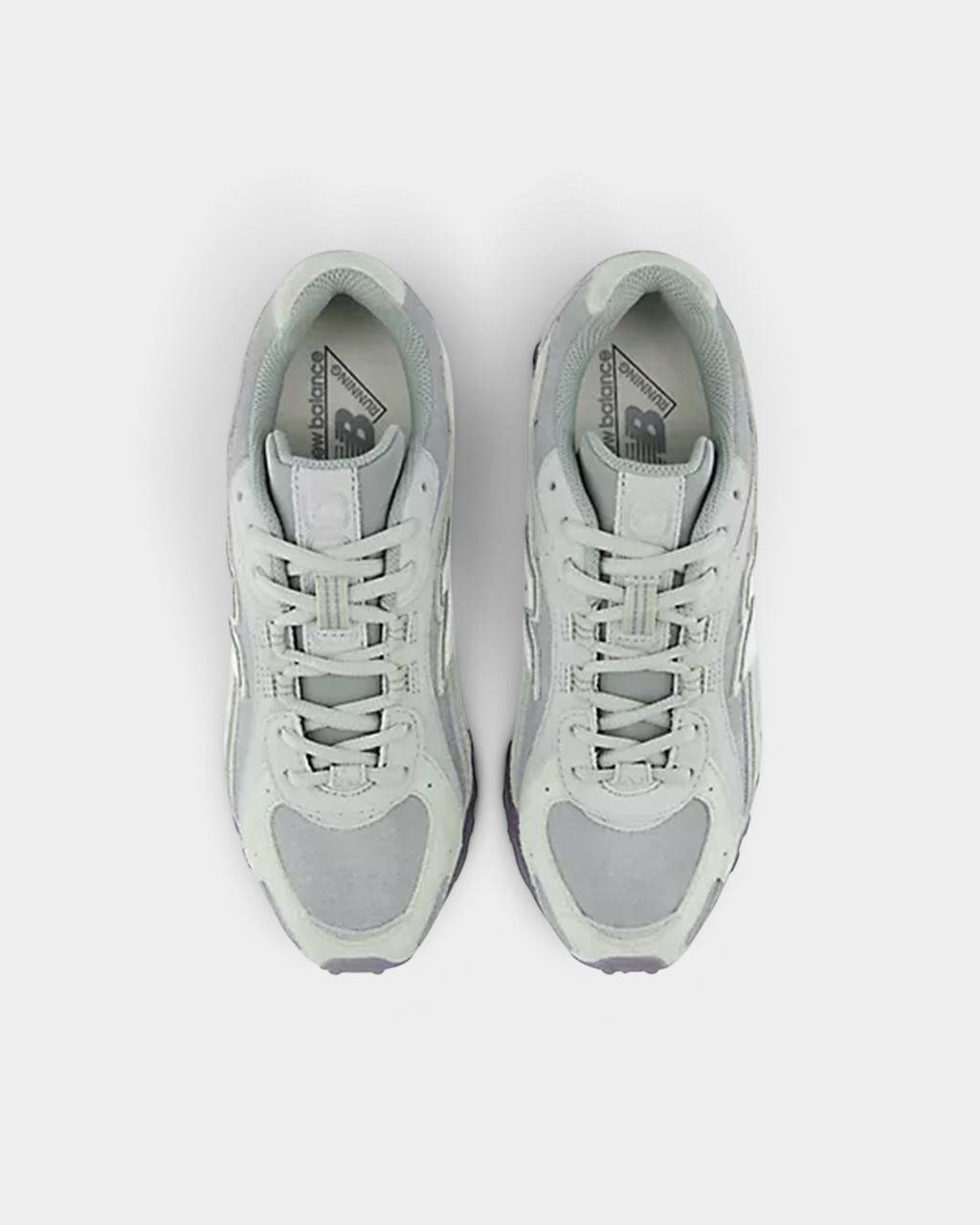 Top-down view of a pair of New Balance 204L sneakers in silver moss and lone star grey, showing the grey laces and New Balance tongue labels