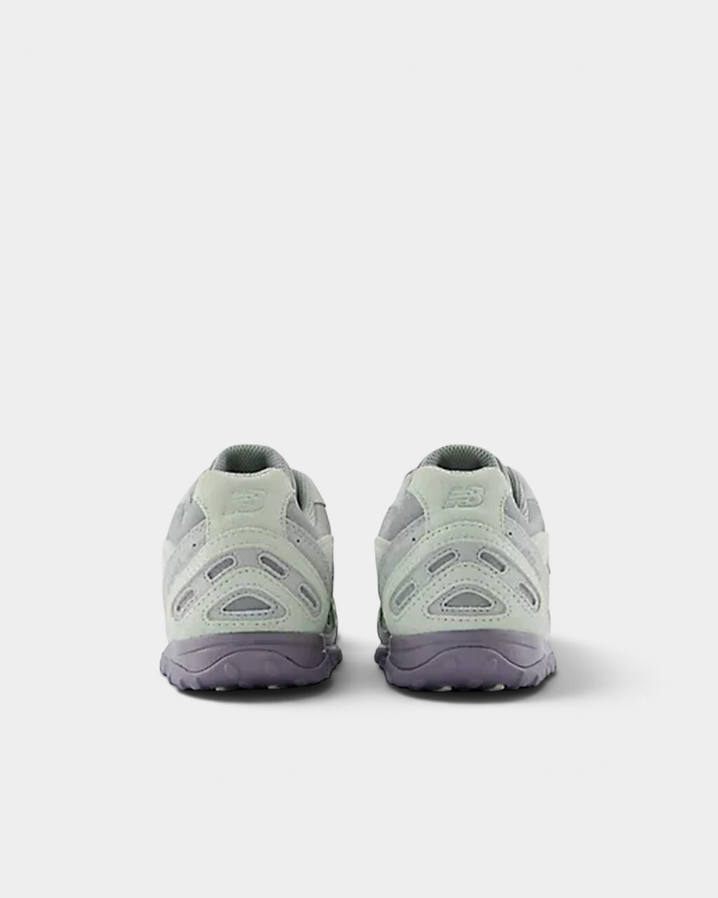 Heel view of a pair of New Balance 204L sneakers in silver moss and lone star grey, with the embossed N on the heel counter