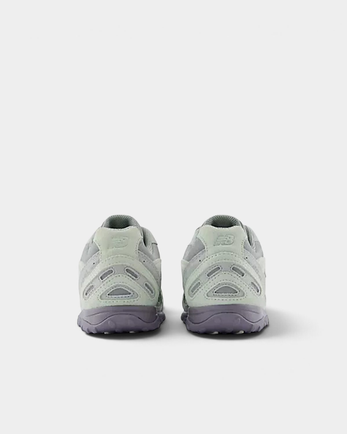 Heel view of a pair of New Balance 204L sneakers in silver moss and lone star grey, with the embossed N on the heel counter