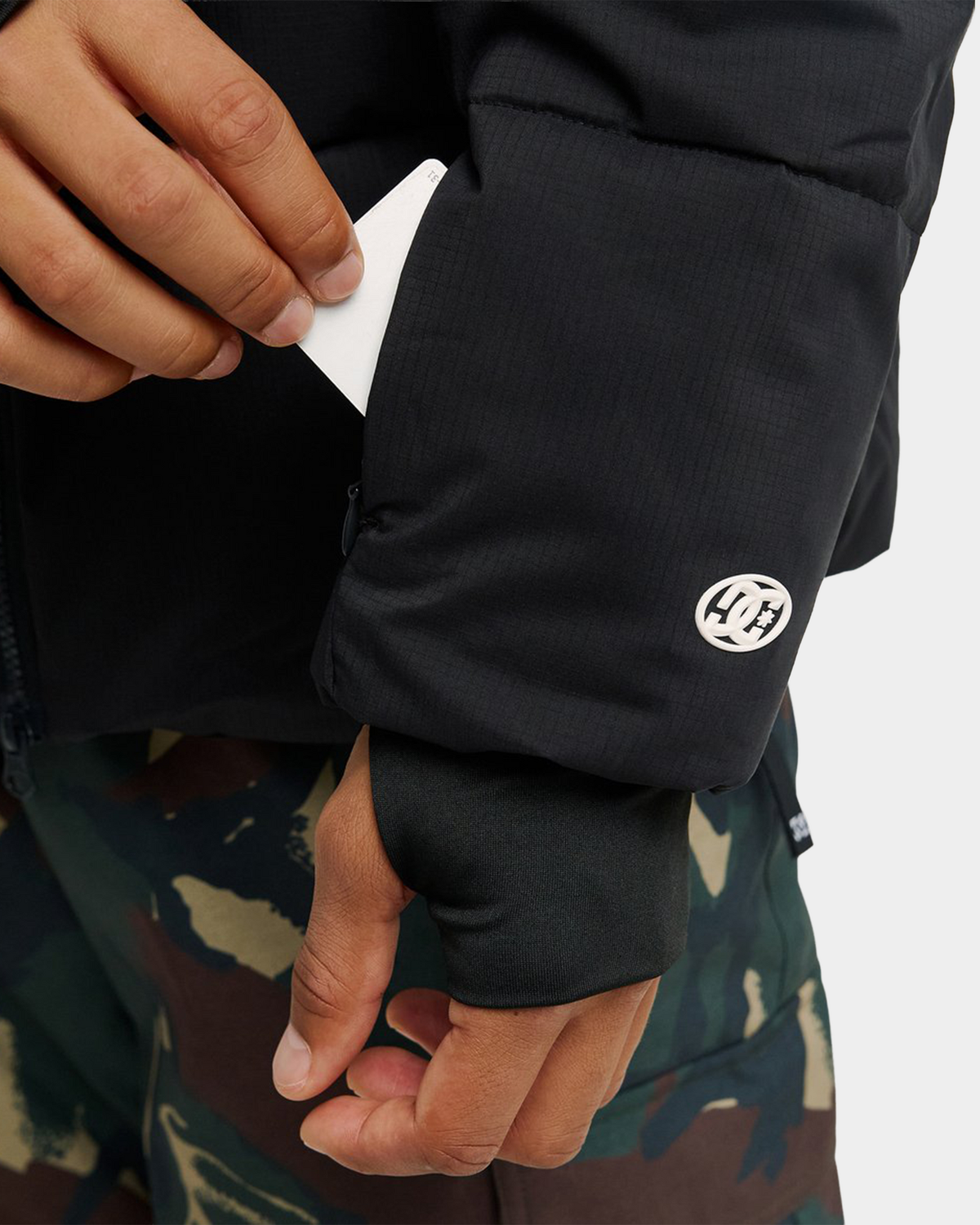 DC Trackstar 10K puffer jacket in black, a technical snow jacket with a two-way front zip and adjustable hem