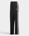 Lockwood Avenue adidas Firebird Loose Track Pants in black, flat front view with white 3-Stripes down the legs, a white Trefoil on the thigh and a zip pocket