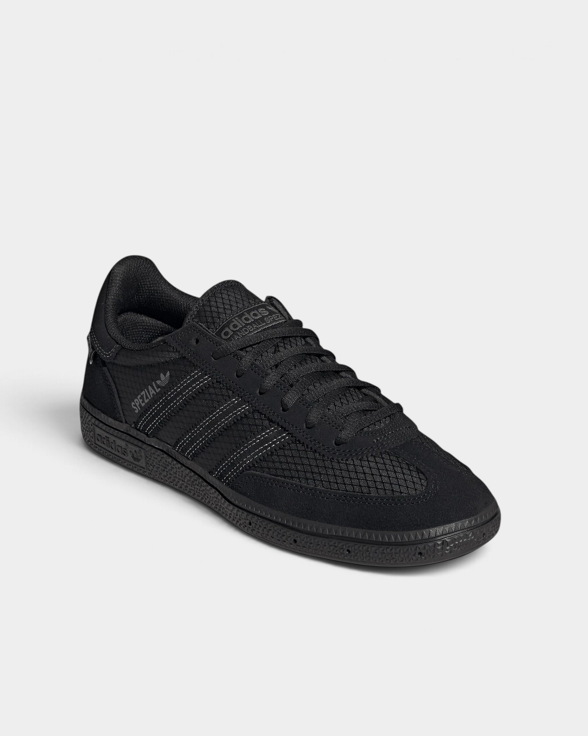 Lockwood Avenue adidas Handball Spezial shoe in all black with a CORDURA ripstop quarter and suede overlays, angled front view of the laces and the suede toe