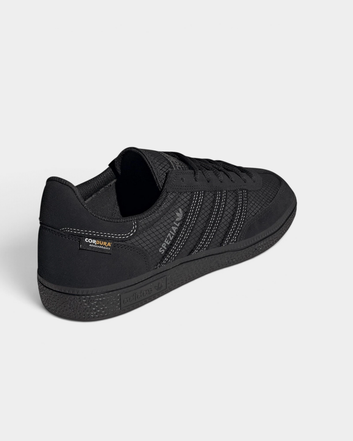 Lockwood Avenue adidas Handball Spezial shoe in all black with a CORDURA ripstop quarter and suede overlays, seen from behind at an angle, the heel with the CORDURA label and the black outsole