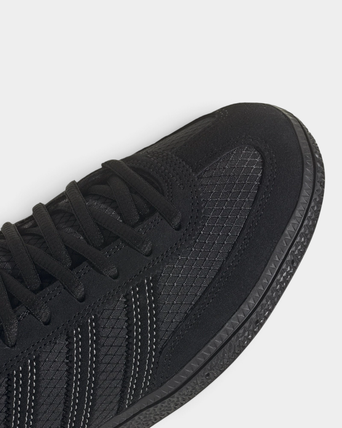 Lockwood Avenue adidas Handball Spezial shoe in all black with a CORDURA ripstop quarter and suede overlays, close up of the laces and the suede toe cap