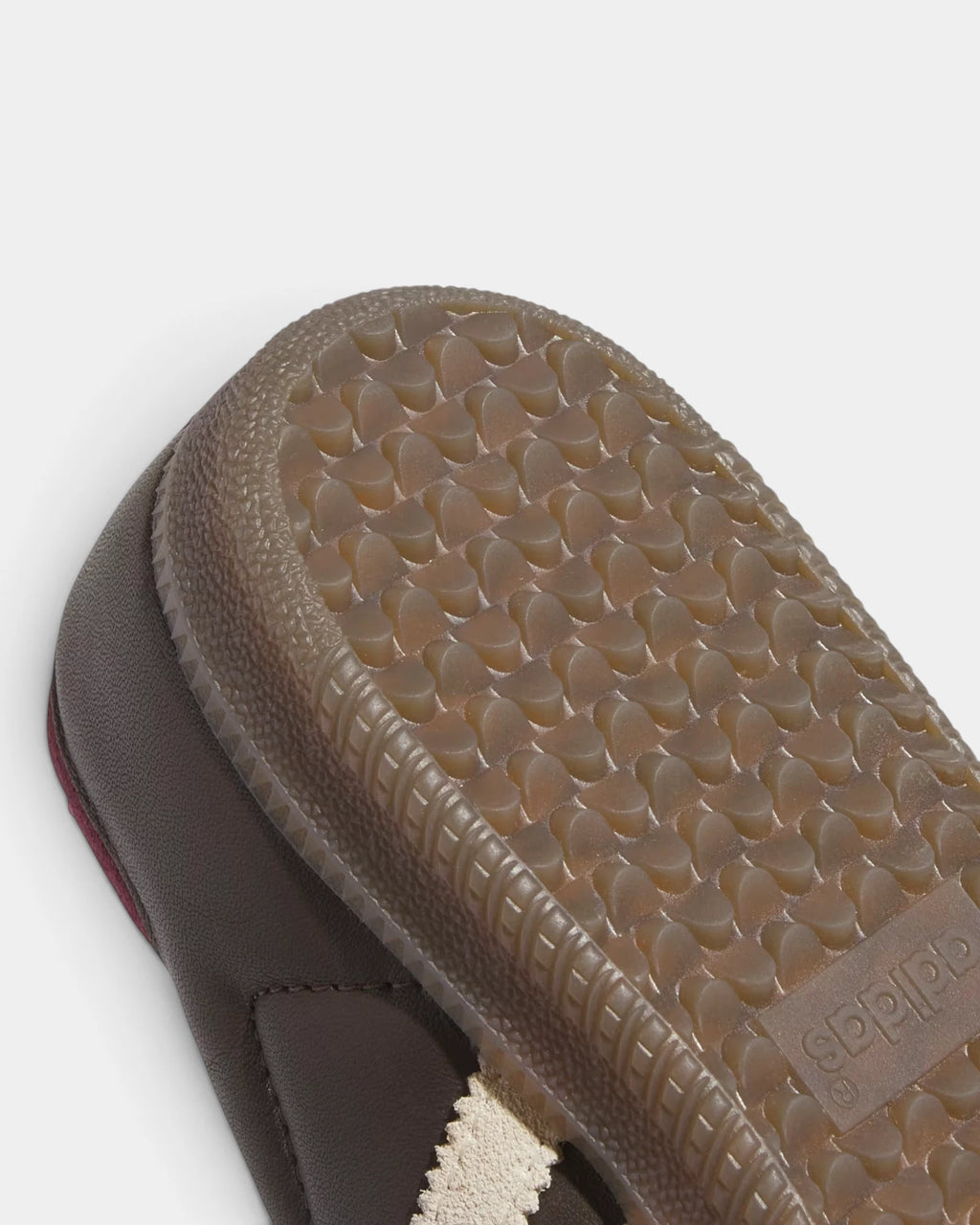 Lockwood Avenue adidas Samba OG W shoe close up, the gum outsole edge against the brown leather upper