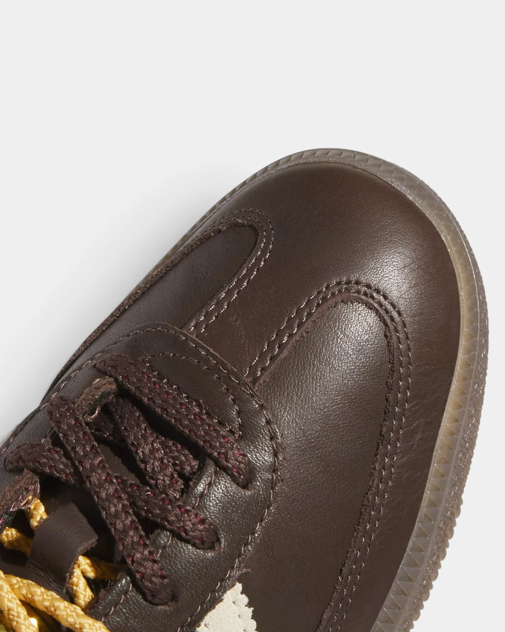 Lockwood Avenue adidas Samba OG W shoe close up, the gold laces and stitched brown leather toe
