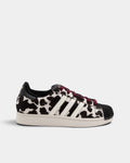 Lockwood Avenue adidas Superstar II W shoe in a black and off-white animal print, side view with the black shell toe, white 3-Stripes and maroon laces