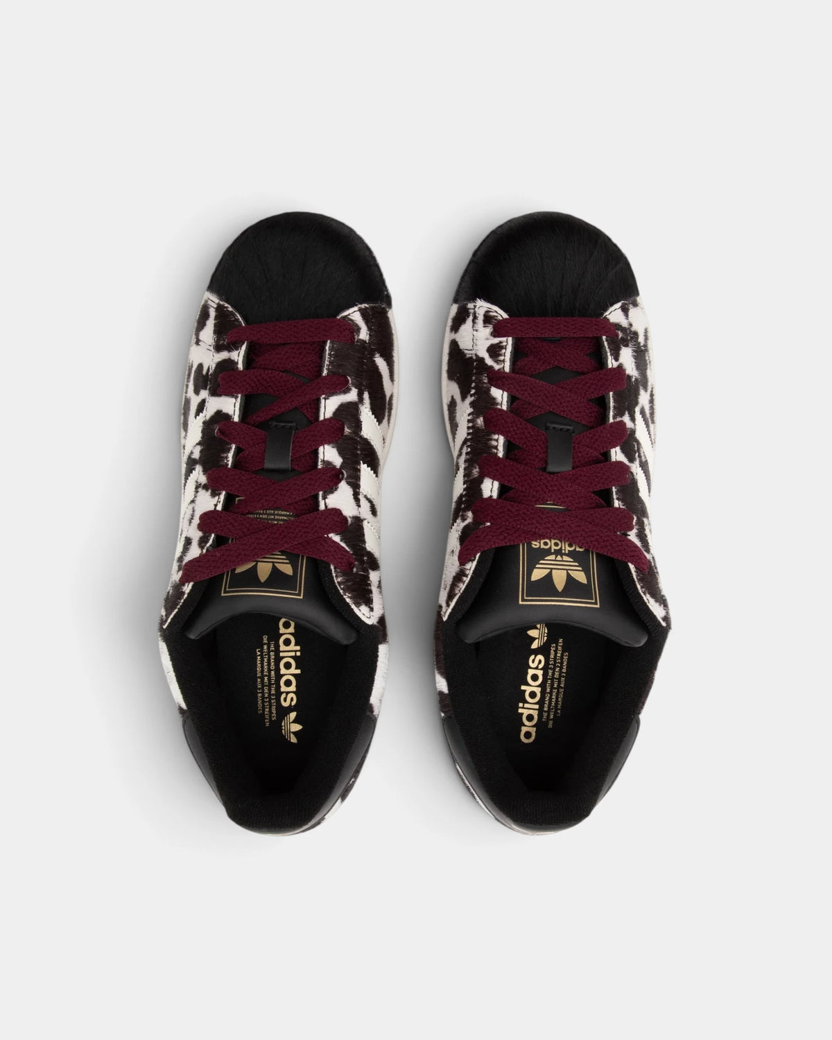 Lockwood Avenue adidas Superstar II W shoes in a black and off-white animal print seen from above, gold adidas wordmark on both tongues