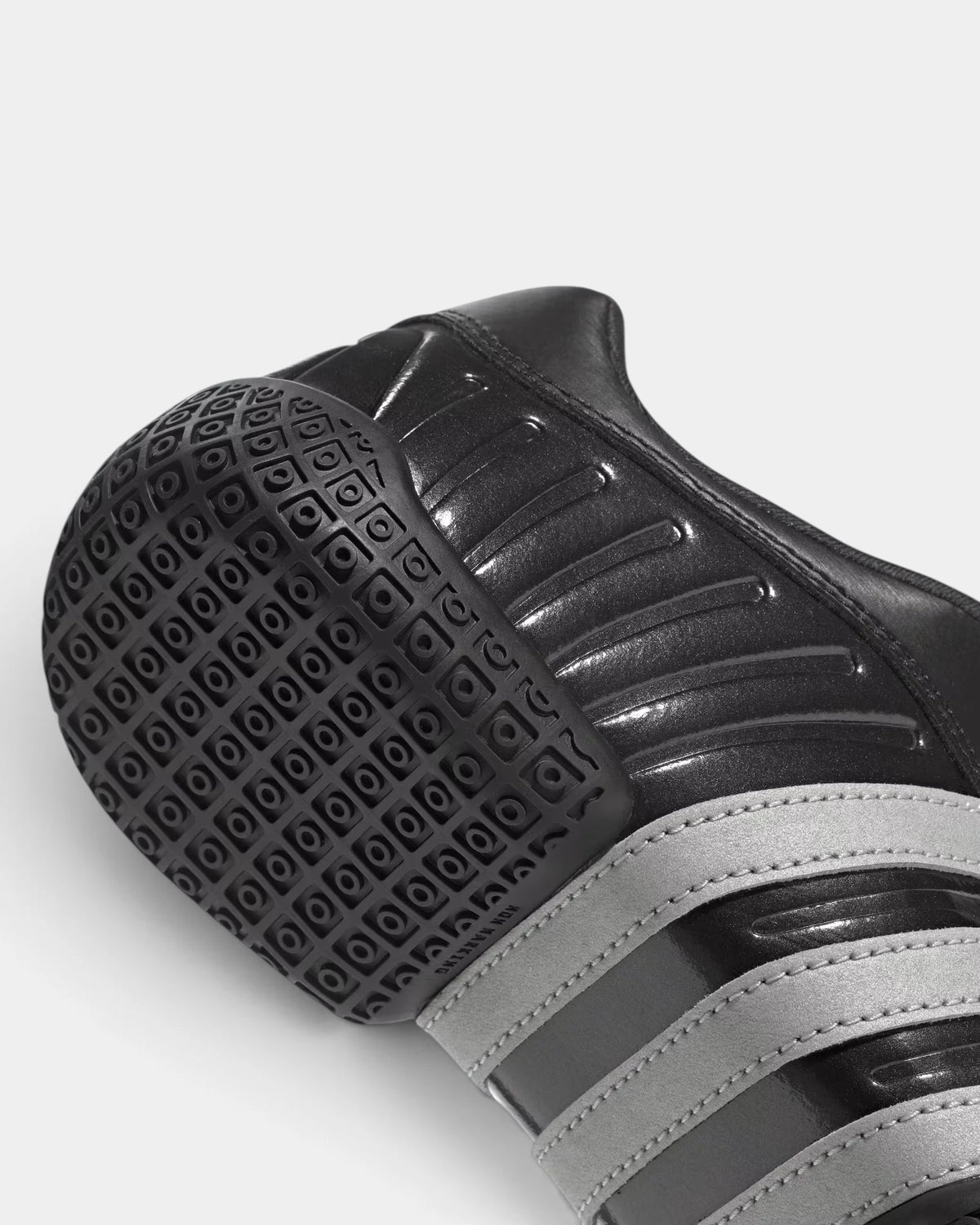 Lockwood Avenue adidas Taekwondo Mei Elite shoe close up, the black heel outsole and its grip pattern