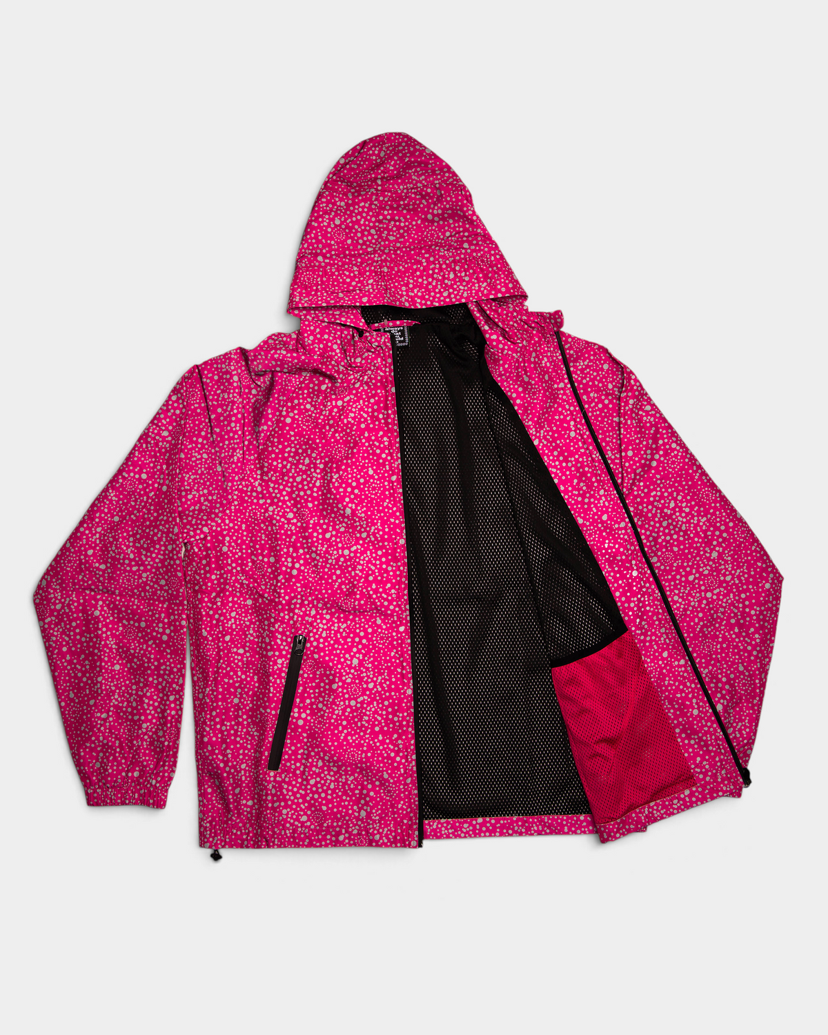 Lockwood Avenue ADWYSD Dotted Bandemic Jacket in Fuchsia with the zip open, black mesh lining and a fuchsia pocket bag