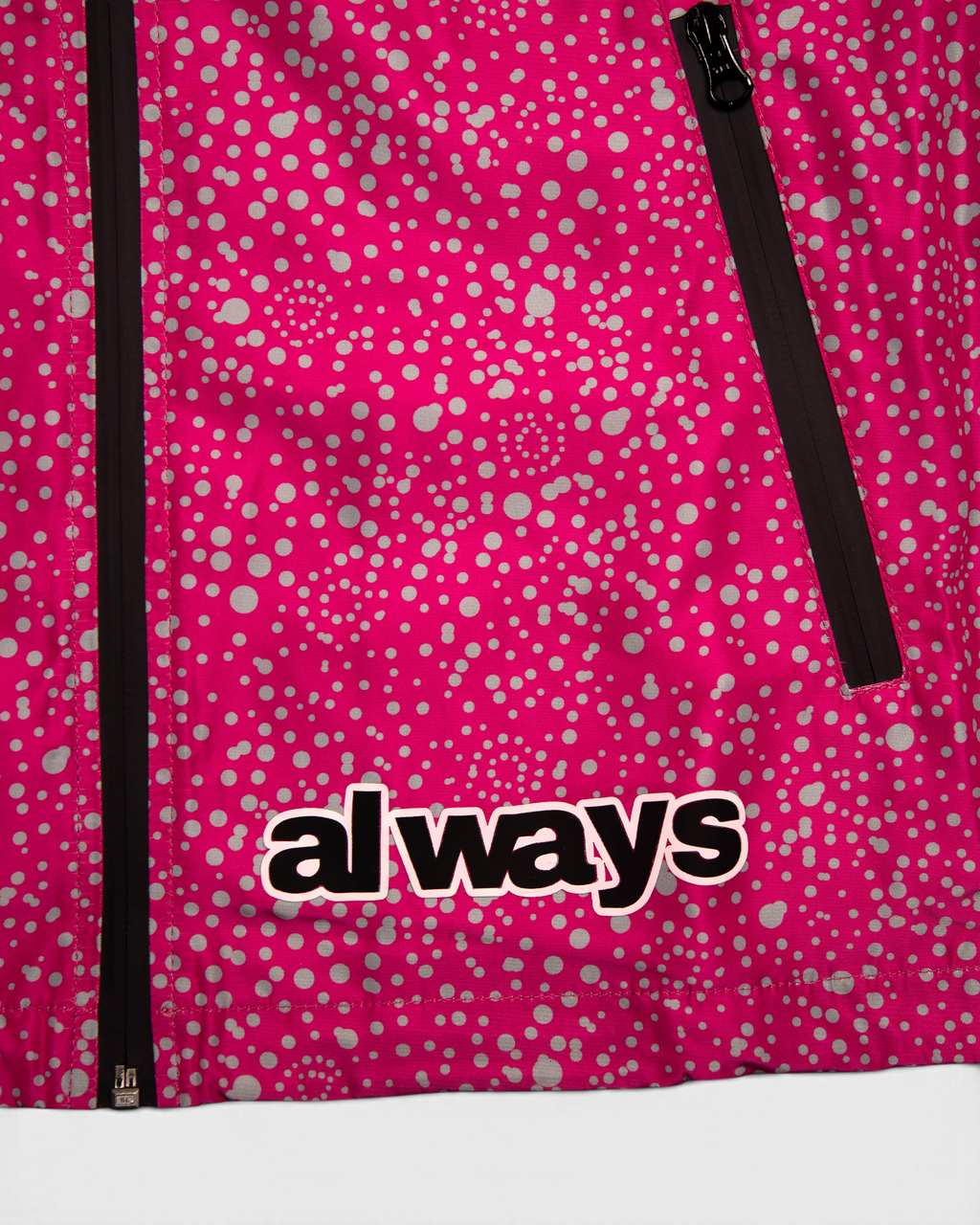Lockwood Avenue ADWYSD Dotted Bandemic Jacket in Fuchsia, close-up of the always logo at the hem next to the black zip