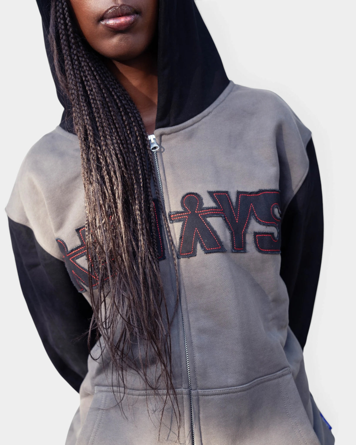 Lockwood Avenue ADWYSD Human Applique Zip-Up Hoodie in Black, worn by a model, grey body with the black ALWAYS appliqué on the chest and a black hood