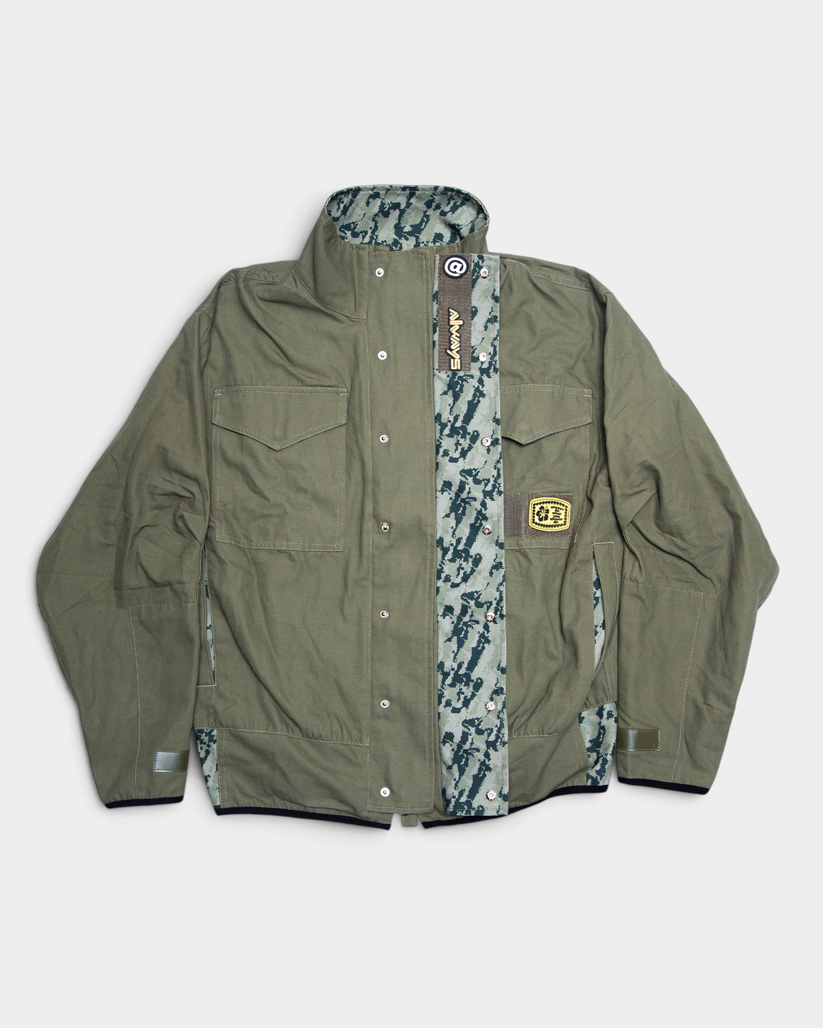 Lockwood Avenue ADWYSD NZ Digi Field Jacket in Green, the snap placket folded back to show a digital camo strip and a woven always tab