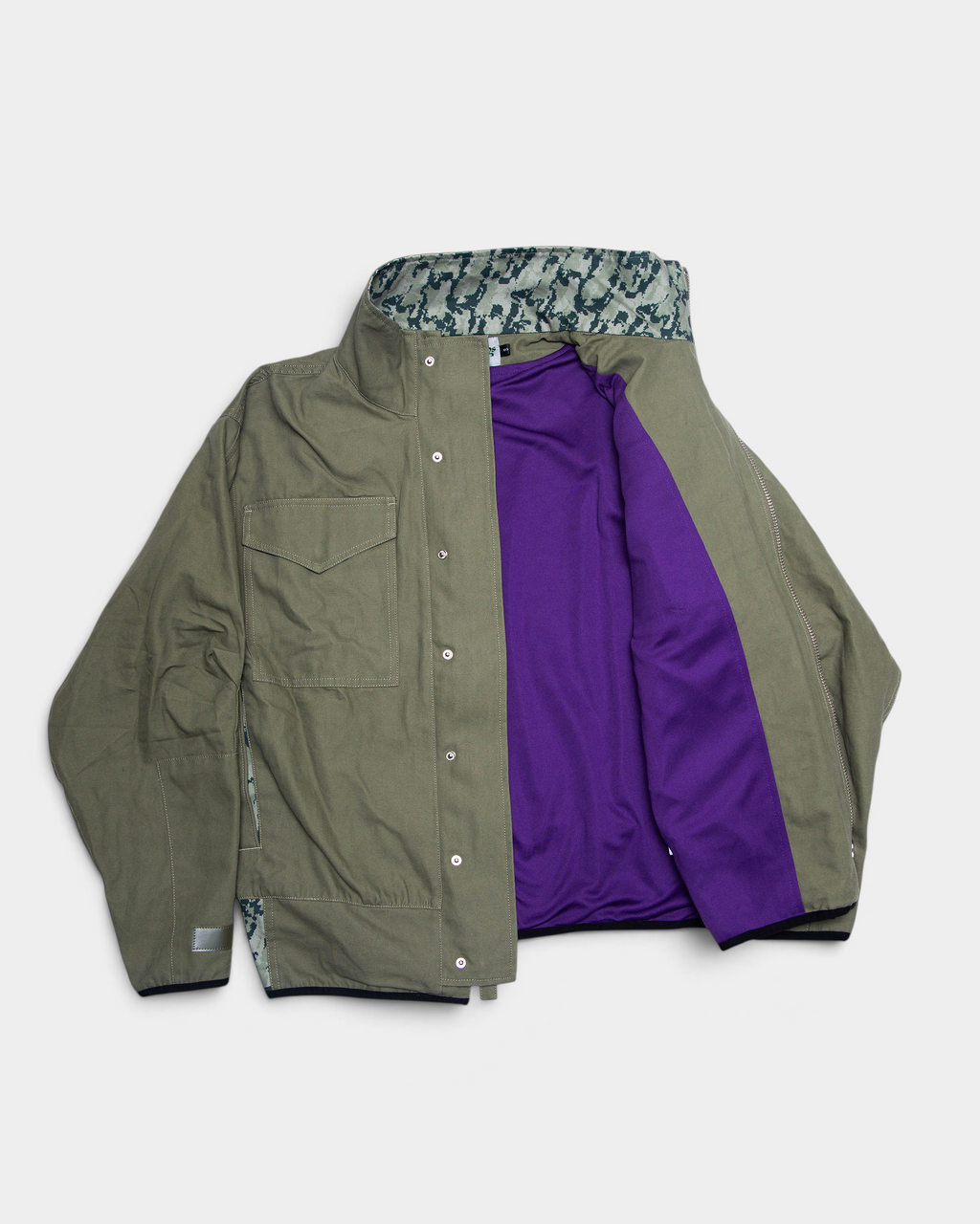 Lockwood Avenue ADWYSD NZ Digi Field Jacket in Green with the front open, purple lining inside and a digital camo collar