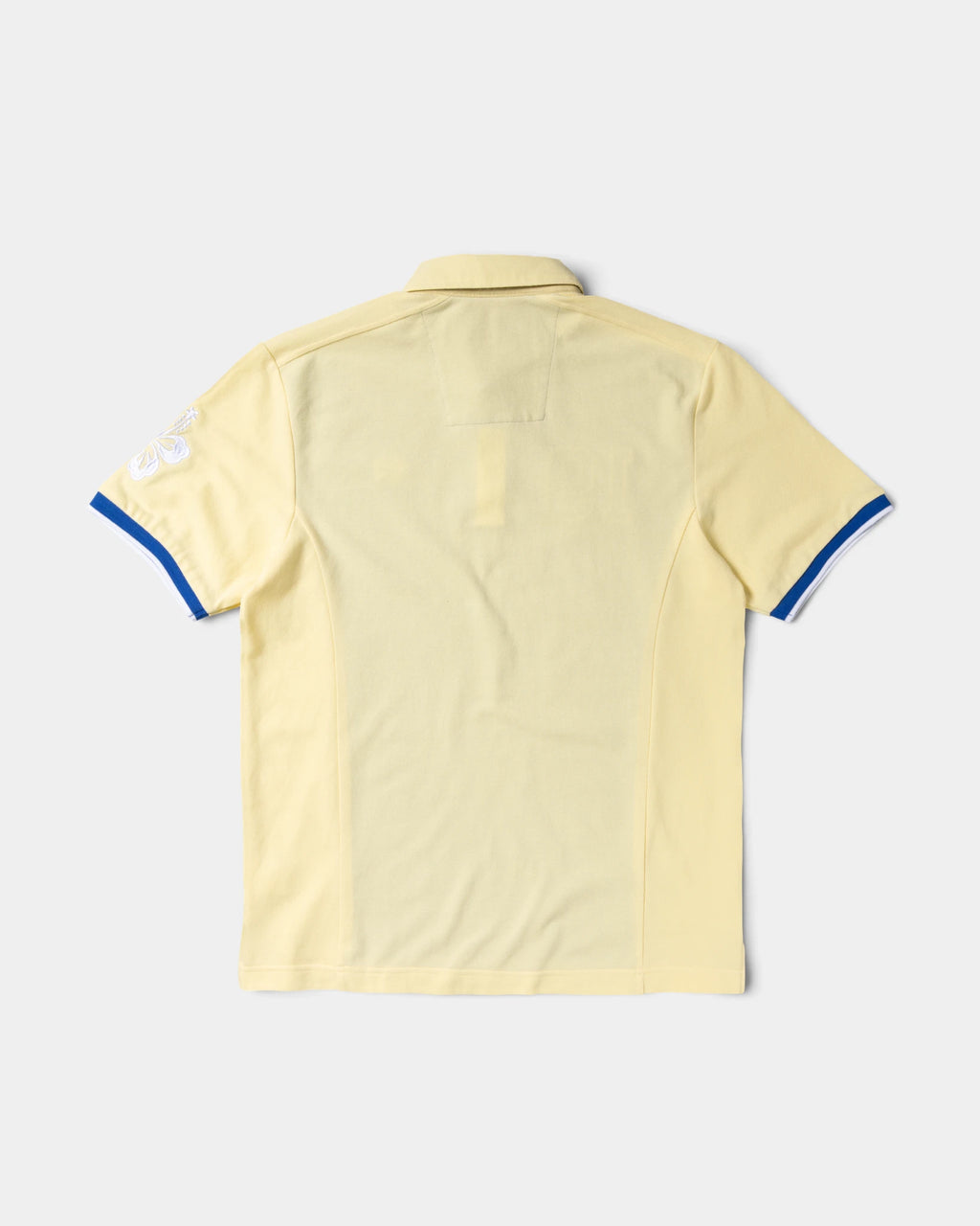 Lockwood Avenue ADWYSD Sport Polo in Yellow/Blue seen from the back, plain pale yellow with blue and white trim on the sleeve cuffs
