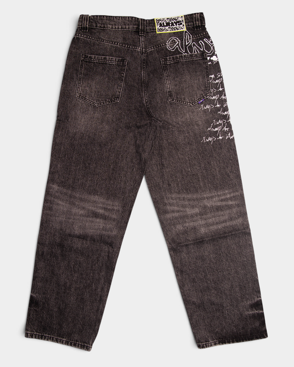 Lockwood Avenue ADWYSD Waza Jeans in Washed Black seen from the back, a woven ALWAYS patch at the waist and script on the right leg
