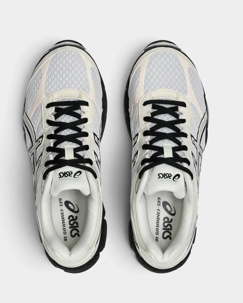 Asics GEL-Cumulus 16 Shoes in White/Cream, pair from above with black laces, a white mesh vamp with cream overlays and the black ASICS logo on the white insoles