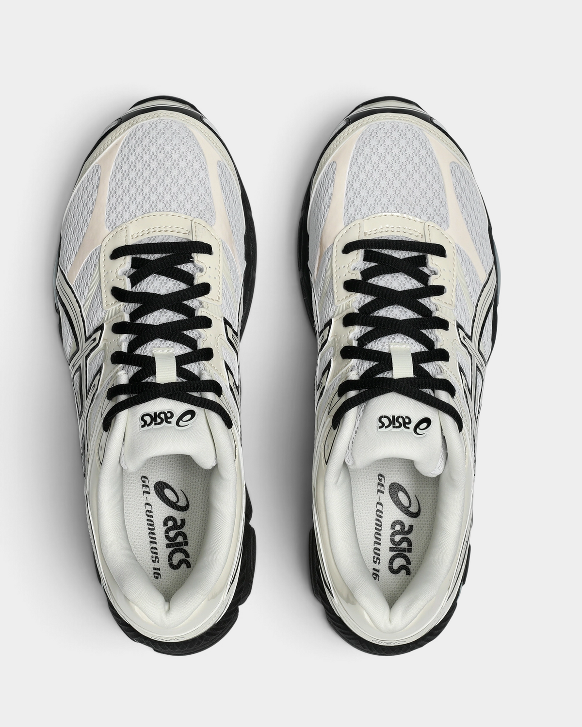 Asics GEL-Cumulus 16 Shoes in White/Cream, pair from above with black laces, a white mesh vamp with cream overlays and the black ASICS logo on the white insoles