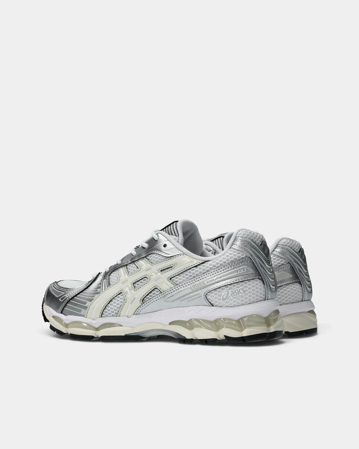 Asics GEL-Kayano 12.1 Shoes in White/Cream, pair from the inner side: white mesh, silver overlays and cream ASICS stripes over a cream FLUIDRIDE midsole