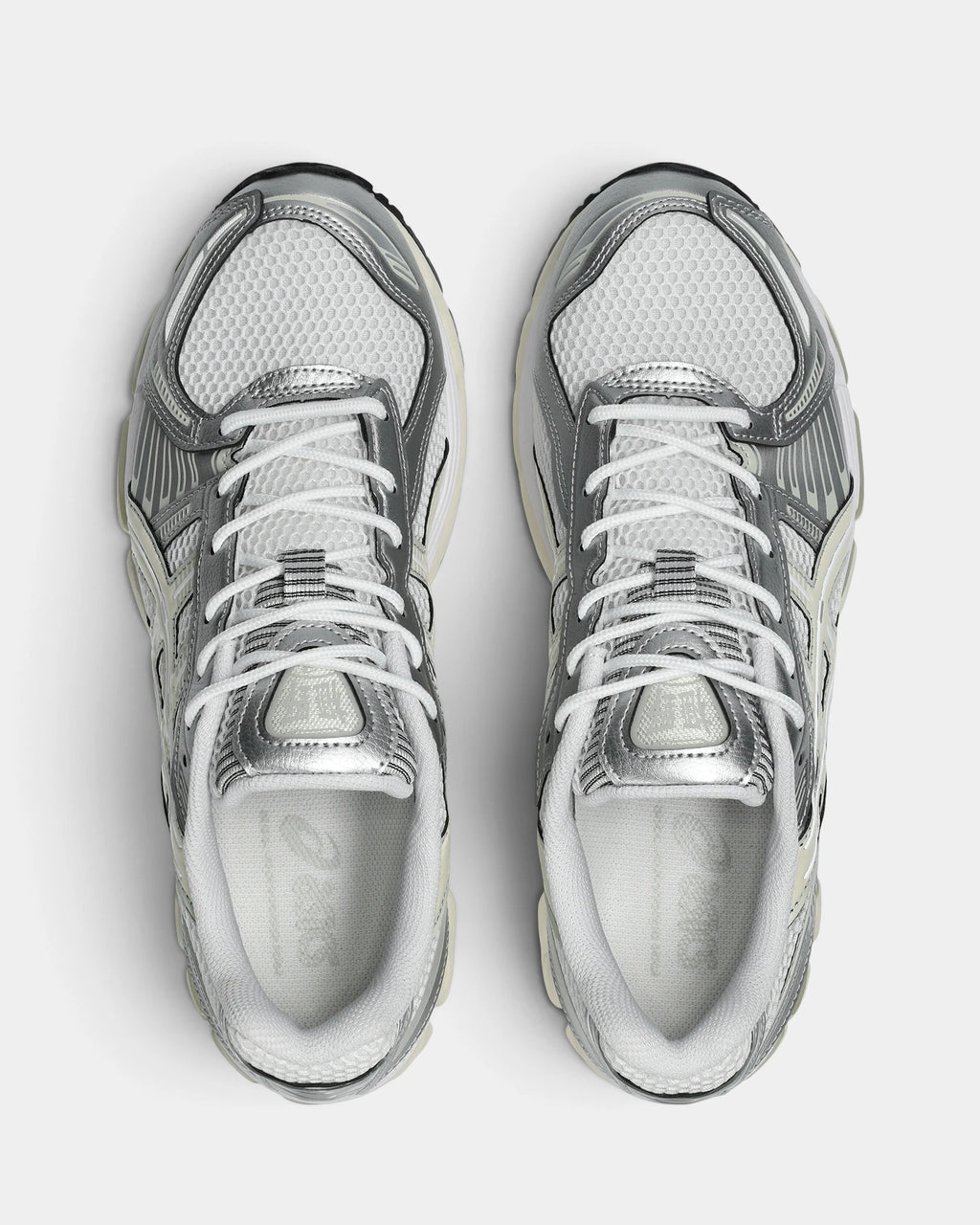 Asics GEL-Kayano 12.1 Shoes in White/Cream, pair from above with white laces, silver eyestays and grey ASICS branding on the insoles