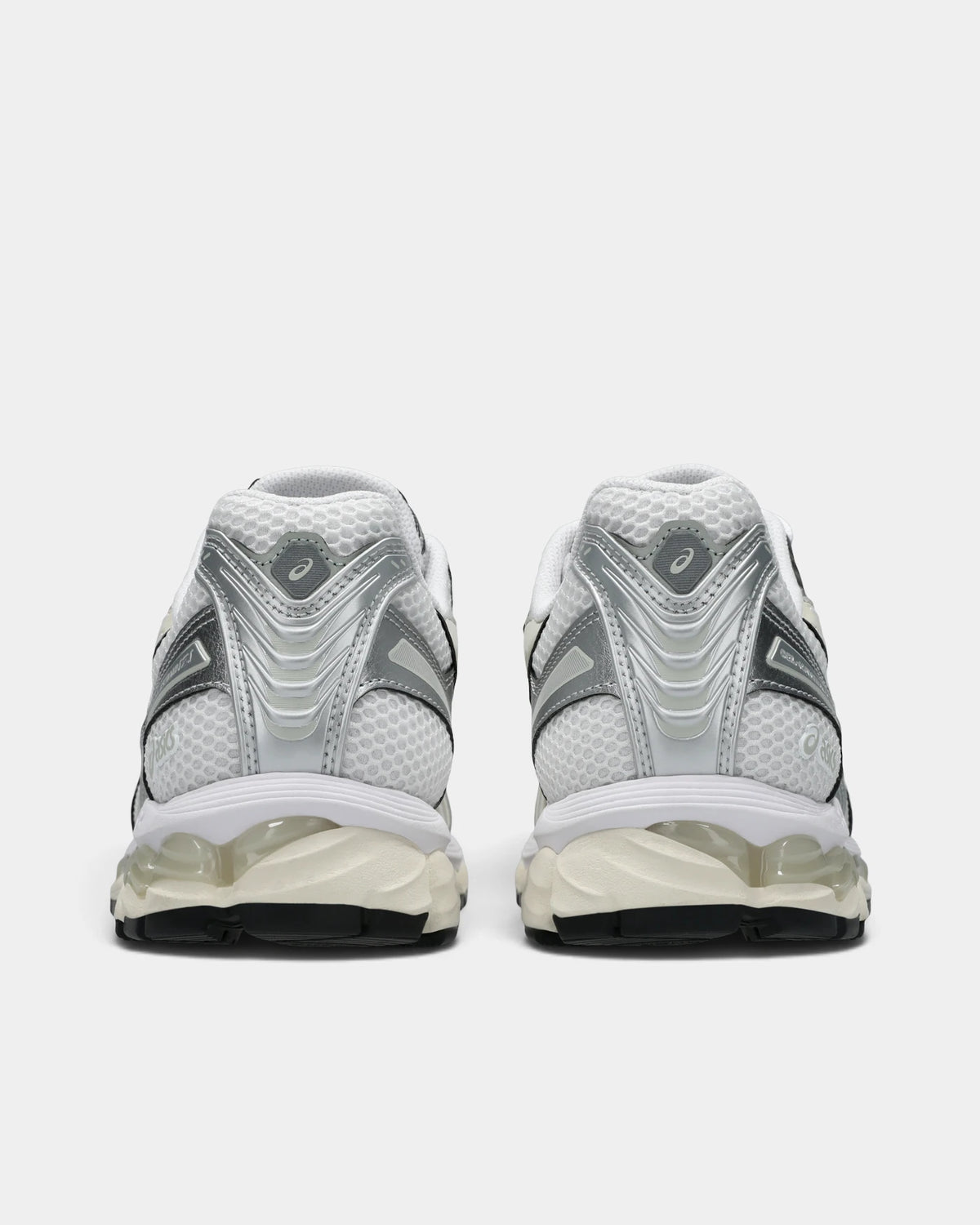 Asics GEL-Kayano 12.1 Shoes in White/Cream, pair from behind: silver heel counters over white mesh and clear GEL windows in the cream midsole