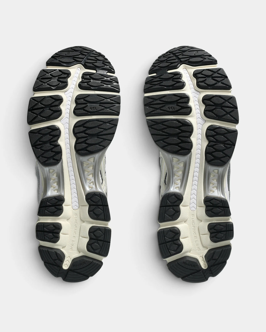 Asics GEL-Kayano 12.1 Shoes in White/Cream, outsoles of the pair: black rubber lugs around a silver and cream midfoot