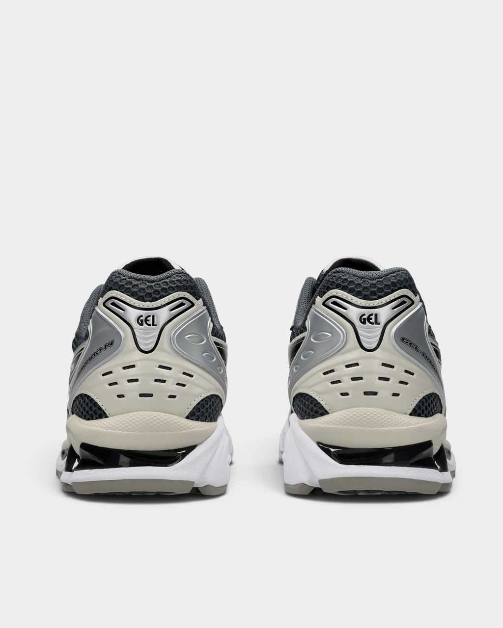 Asics GEL-Kayano 14 Shoes in Carrier Grey/Black, pair from behind: silver GEL heel clip over graphite mesh, a perforated cream heel counter and a white sole