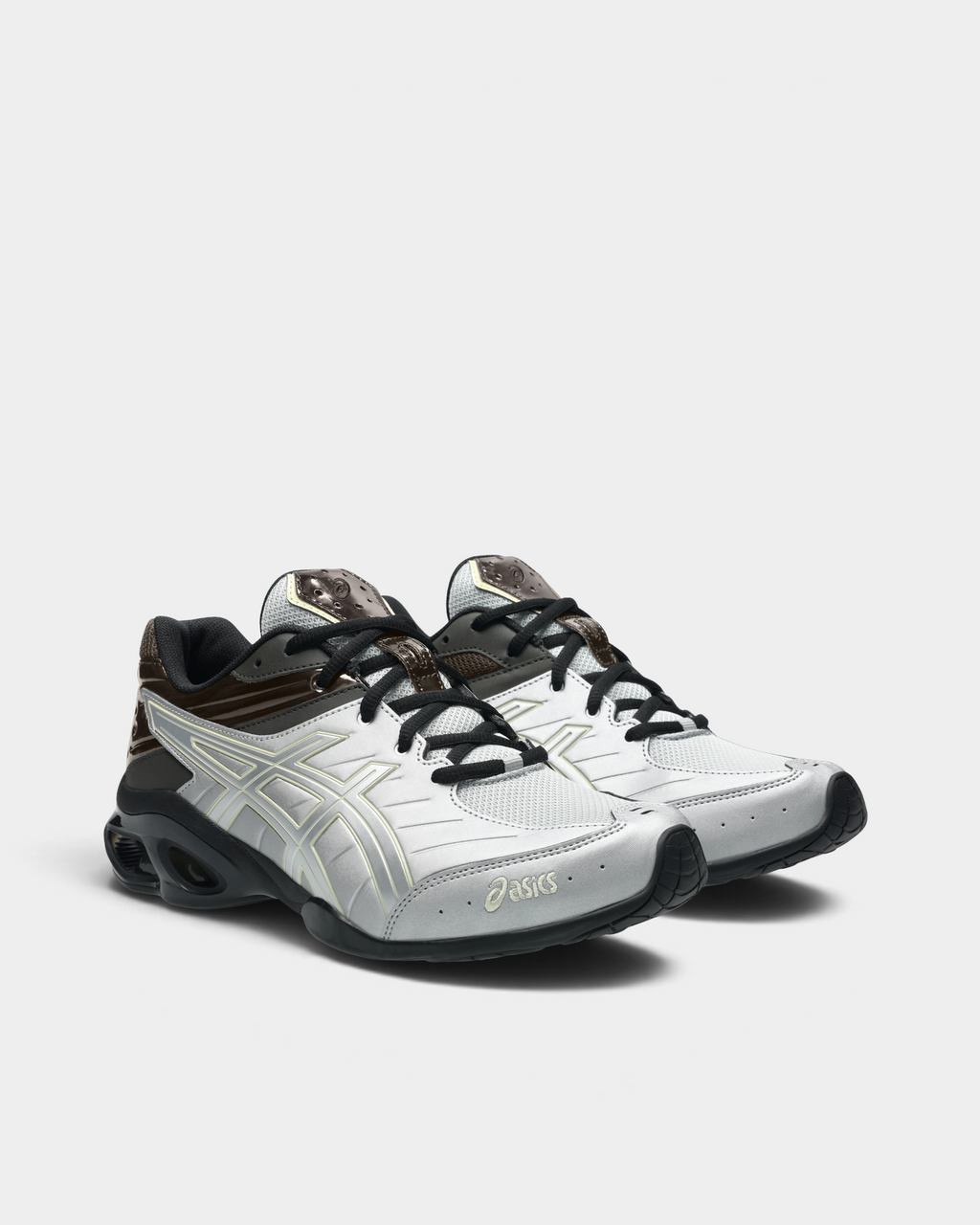 Asics GEL-Kinetic FR Shoes in Pure Silver/Black Coffee, pair at a three-quarter front angle showing the silver toe overlays, black laces and the black sole