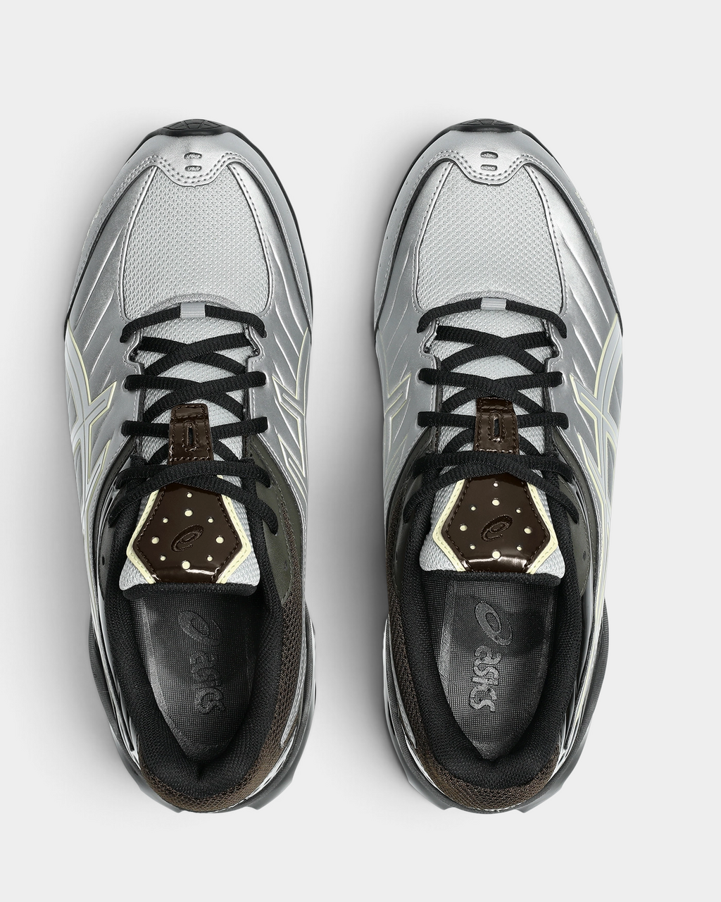 Asics GEL-Kinetic FR Shoes in Pure Silver/Black Coffee, pair from above with black laces, silver overlays and a dark brown heel cap with the ASICS logo on the insoles