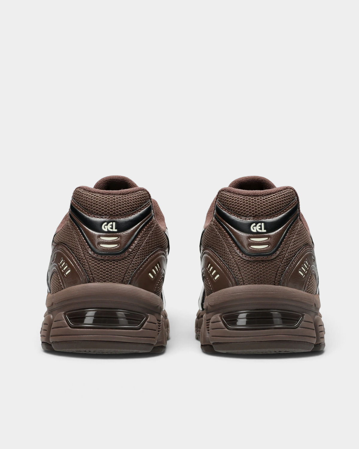 Asics GEL-Stratus MC Shoes in Brown Storm, pair from behind: a black heel tab with GEL lettering and cream marks, a brown heel counter and a visible gel unit in the midsole