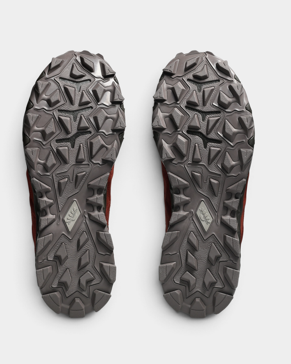 Asics GEL-Transcend FJ Shoes in Rusted Rock/Black Coffee, outsoles of the pair: gray rubber with deep angular lugs and a small ASICS badge at midfoot