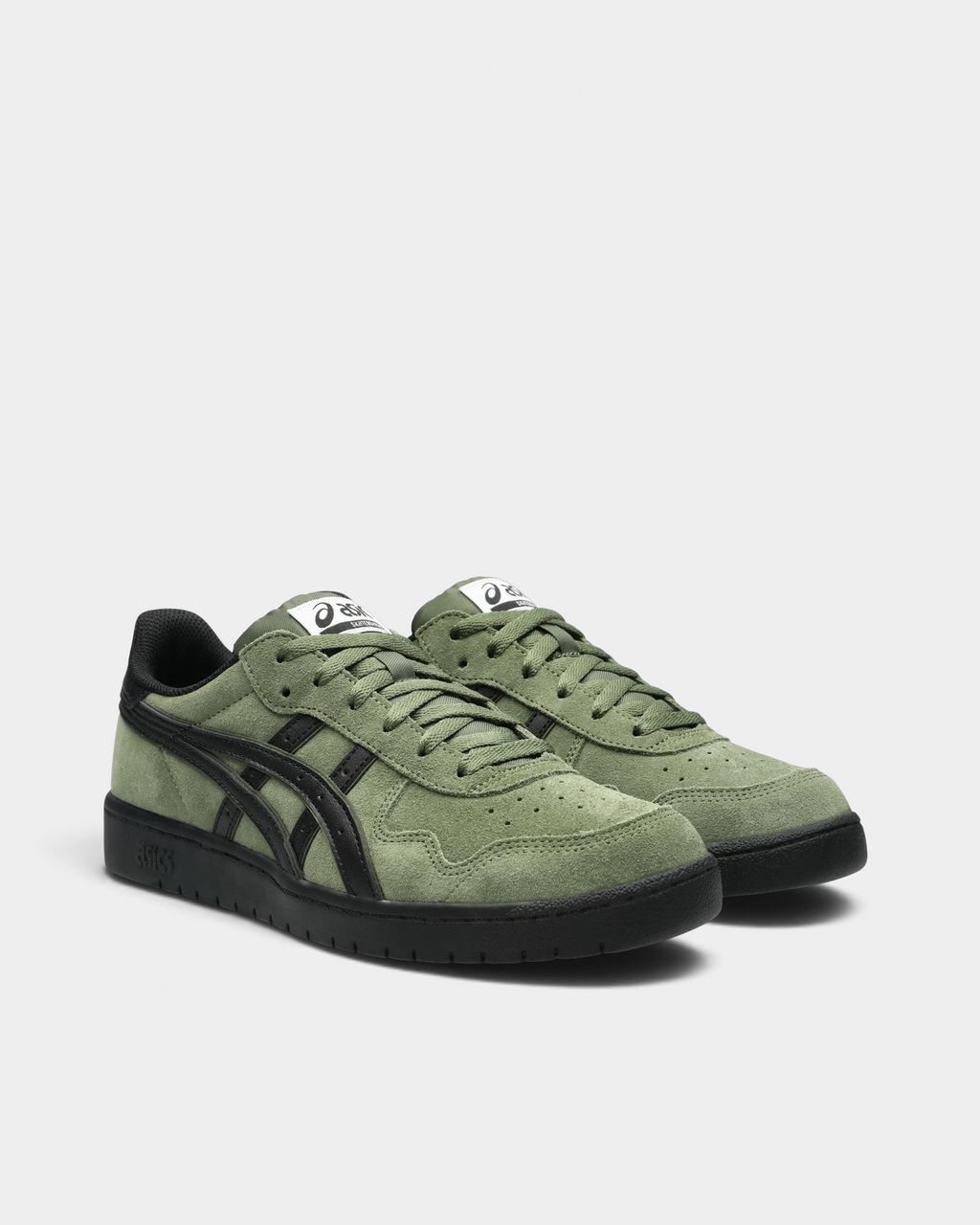 Asics Skateboarding Japan Pro Shoes in Moss/Black, pair at a three-quarter front angle showing moss-green laces, black stripes and eyestays, and the ASICS Skateboarding label on the tongue