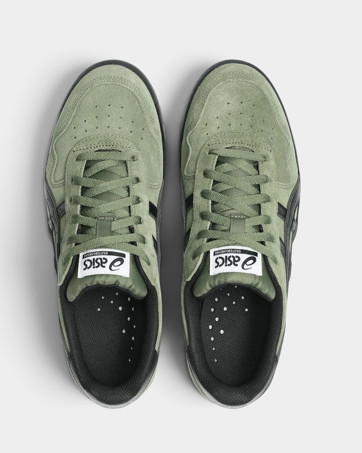 Asics Skateboarding Japan Pro Shoes in Moss/Black, pair from above with moss-green laces and toe panels, black collar lining and eyestays, and a white ASICS Skateboarding tongue label