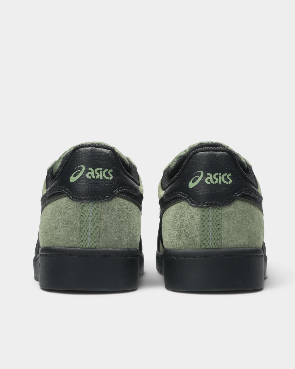 Asics Skateboarding Japan Pro Shoes in Moss/Black, pair from behind: a green ASICS script on the black heel tab, moss-green heel panel with a grey stitched strip and a black sole