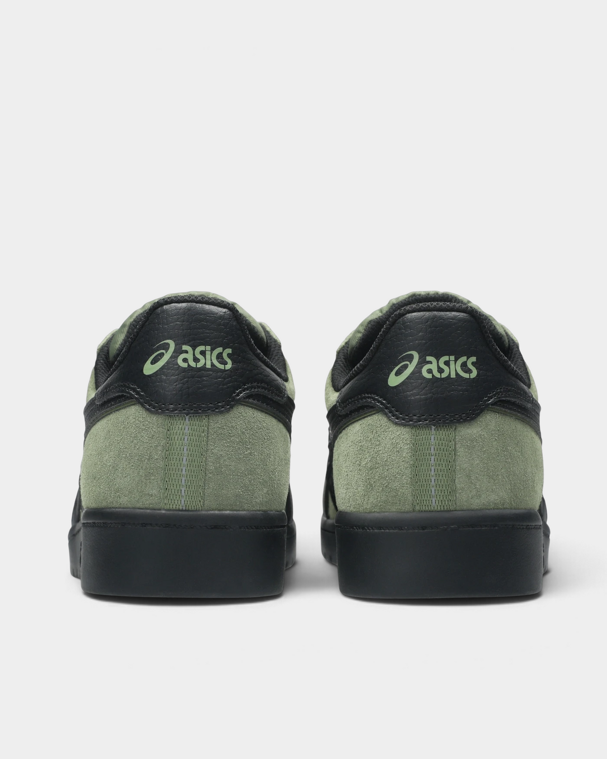 Asics Skateboarding Japan Pro Shoes in Moss/Black, pair from behind: a green ASICS script on the black heel tab, moss-green heel panel with a grey stitched strip and a black sole