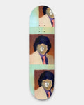 Baker Rowan Zorilla Mario Deck 8.5", a painted portrait of a figure in a pale suit and pink tie with a smiling mask for a face, repeated three times down the board