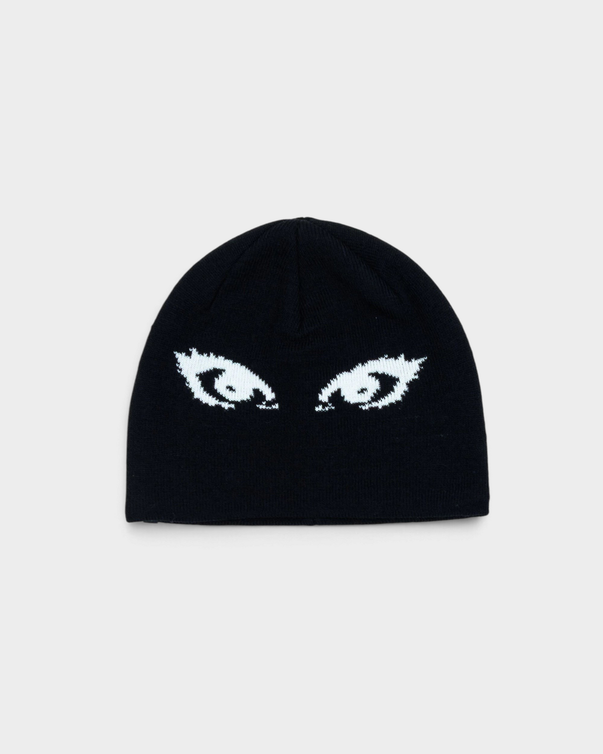 Lockwood Avenue Beyond Medals Jacquard Beanie Eyes in black, laid flat, a close-fitting beanie with a pair of white lashed eyes knitted across the front