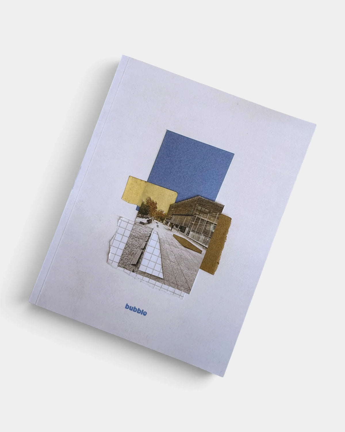 Cover of Bubble 005: a collage of a paved skate plaza photo, a blue paper block, a yellow note and graph paper on an off-white page, with the blue bubble wordmark at the bottom