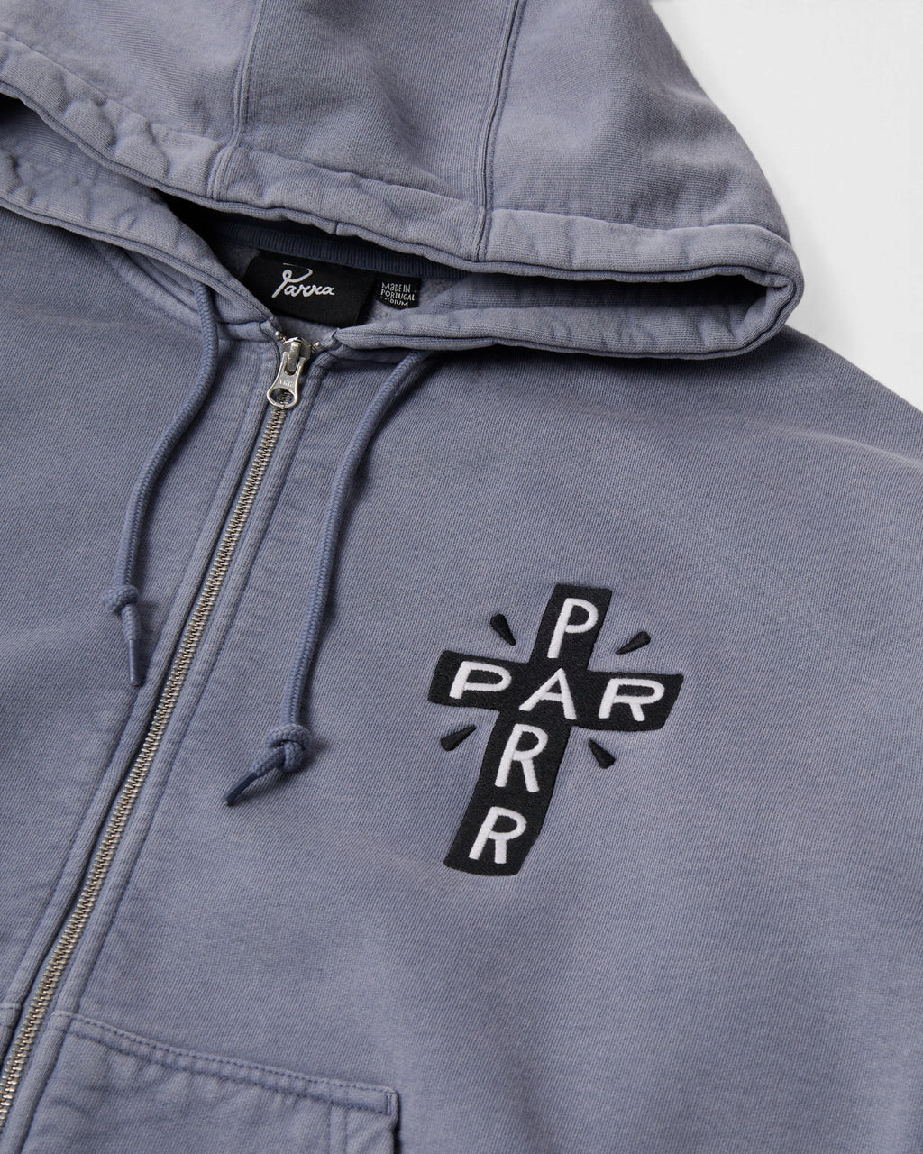 by Parra A Cross to Bear Zip Hooded Sweatshirt - Blue, close-up of the chest embroidery, zip and drawcord
