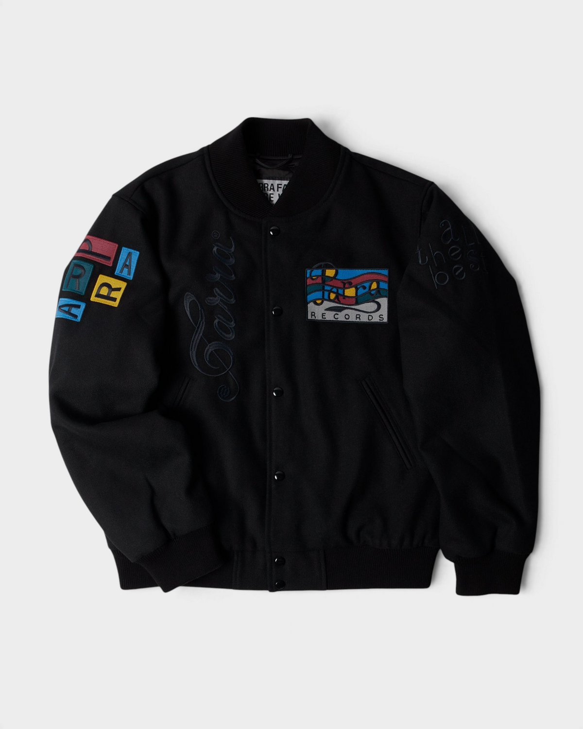 by Parra All the Best Varsity Jacket - Black, front flat-lay with a Parra Records patch, tonal Parra embroidery and a letter patch sleeve