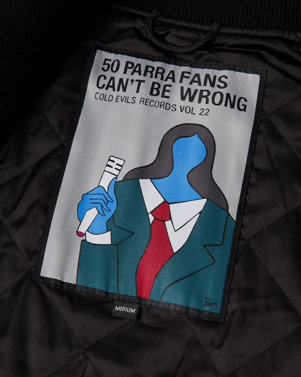 by Parra All the Best Varsity Jacket - Black, close-up of the 50 Parra Fans Can't Be Wrong patch on the lining