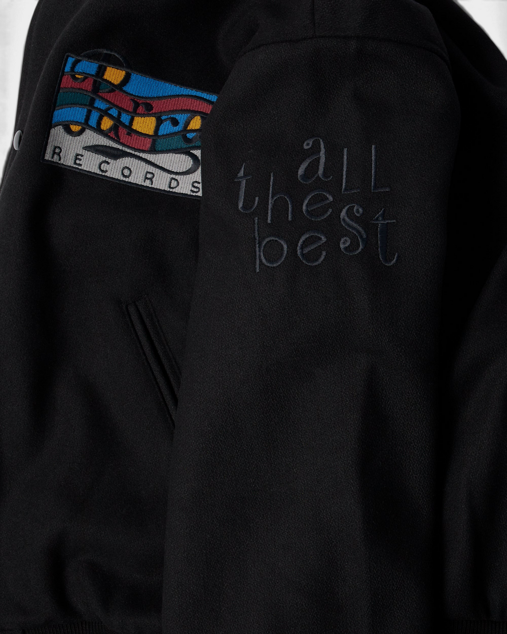 by Parra All the Best Varsity Jacket - Black, close-up of the All the Best sleeve embroidery