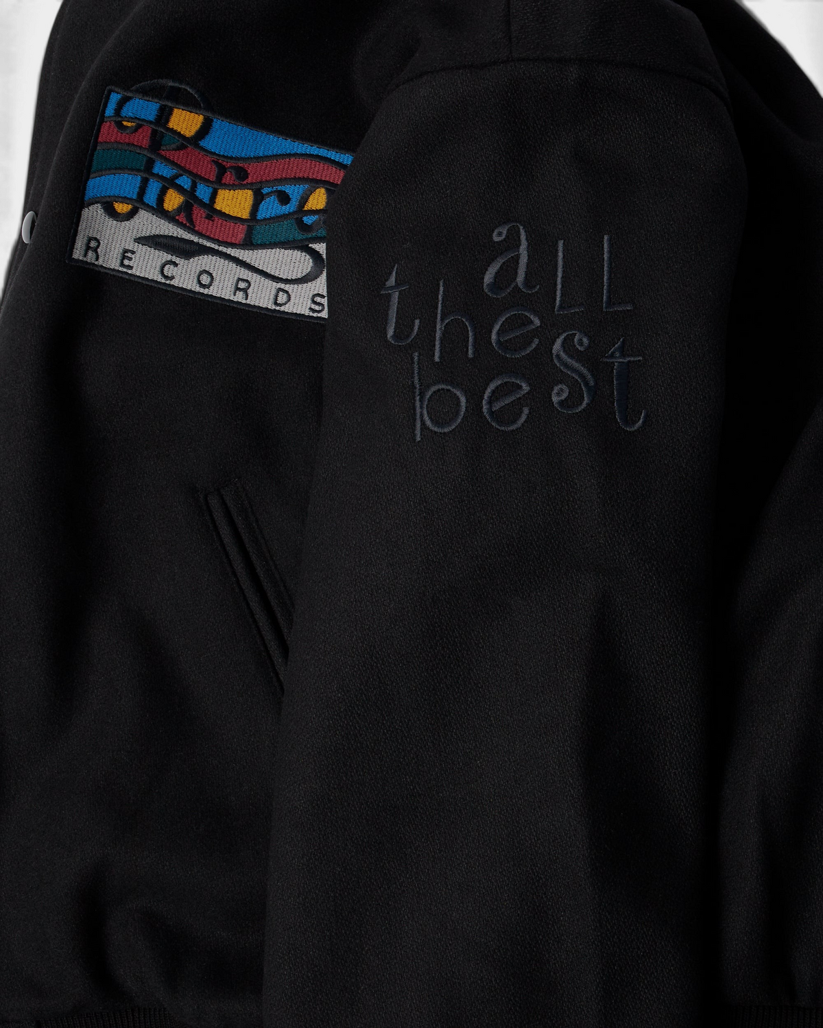 by Parra All the Best Varsity Jacket - Black, close-up of the All the Best sleeve embroidery