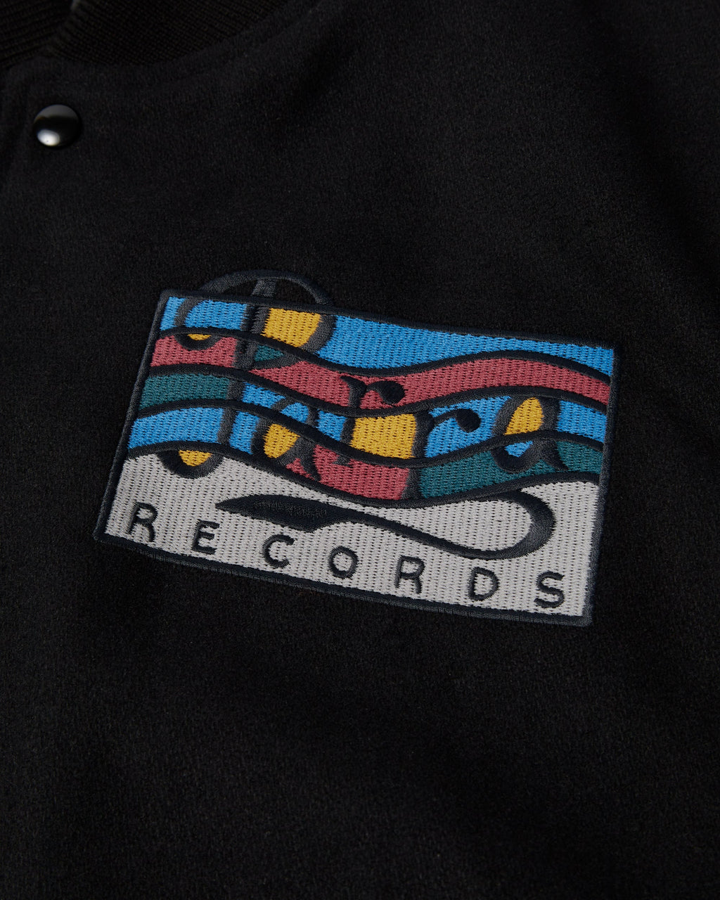 by Parra All the Best Varsity Jacket - Black, close-up of the Parra Records patch