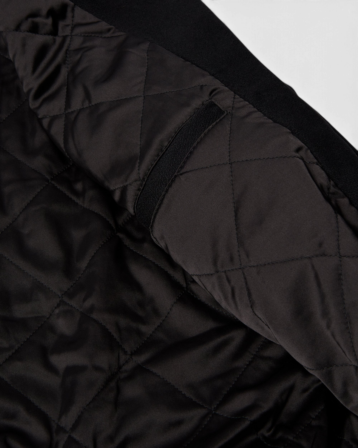 by Parra All the Best Varsity Jacket - Black, close-up of the quilted lining