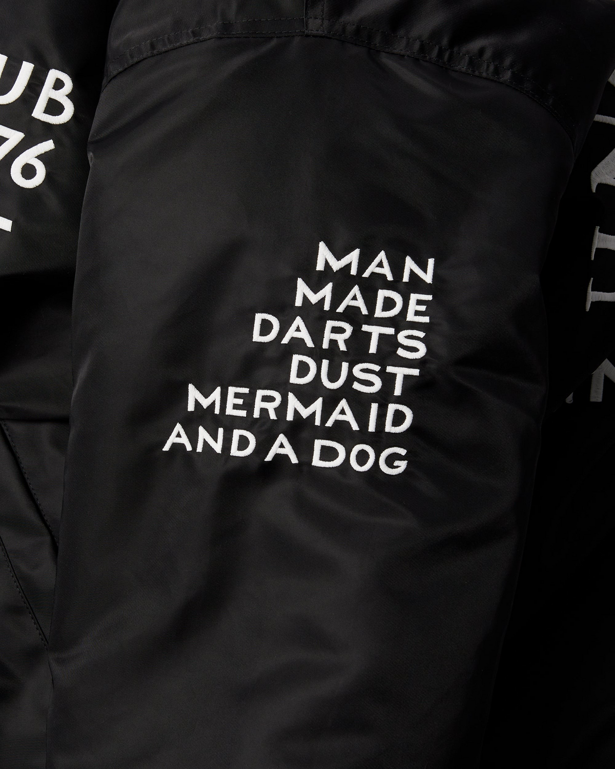 by Parra Club Not 1976 Satin Bomber Jacket - Black, close-up of the Man Made Darts Dust Mermaid and a Dog sleeve embroidery