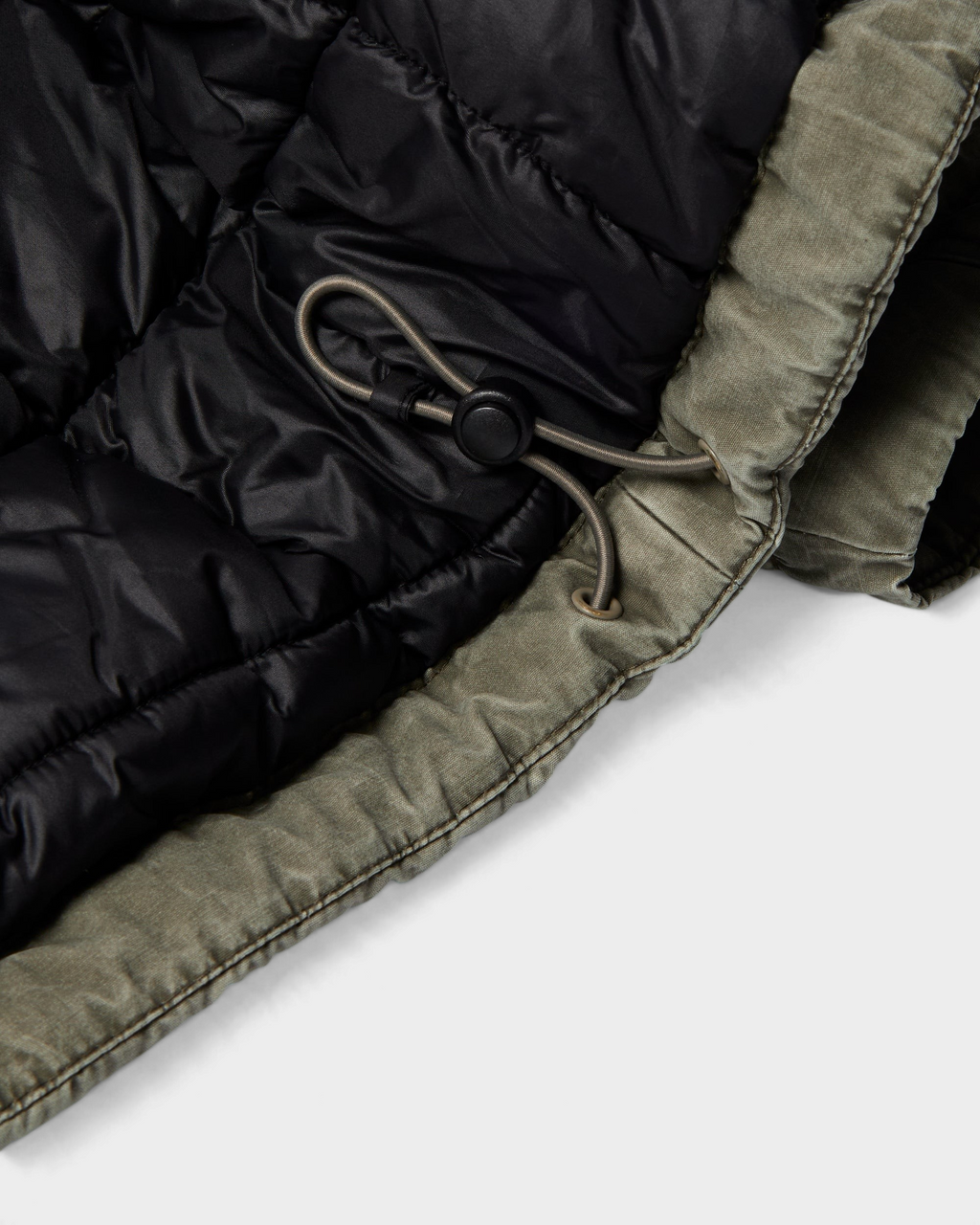 by Parra Darwin Takes Flight Jacket - Green, close-up of the hem drawcord inside