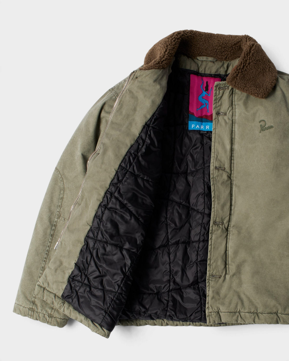 by Parra Darwin Takes Flight Jacket - Green, opened up, showing the quilted lining and the Parra label